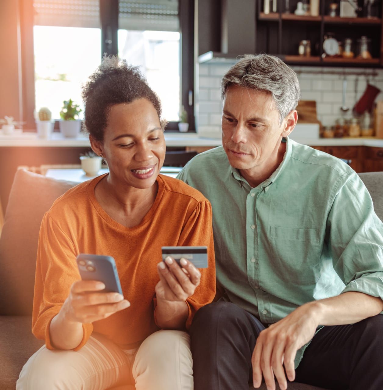 A customer entering credit card information on a phone